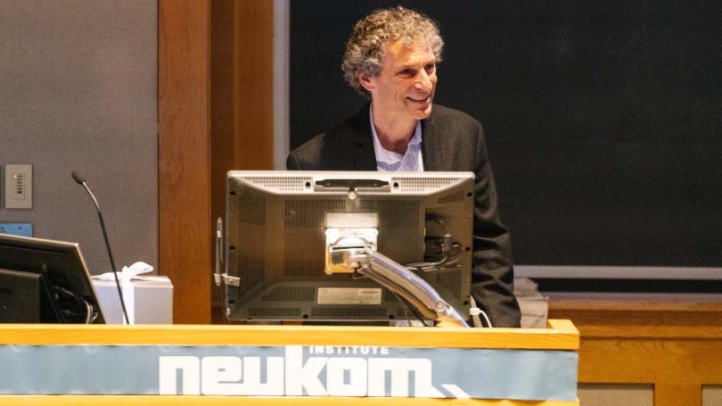Professor Dan Rockmore speaking at a podium.