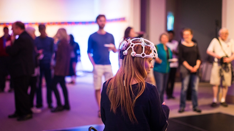 Students explore exhibits at the DAX event.